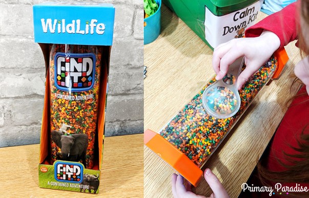 Image of the Find It Wildlife Tube game that is perfect for a Calm Down corner. A student uses a magnifying glass to find the hidden animals 