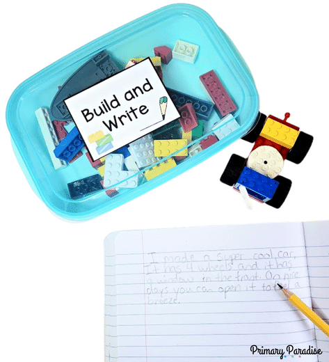 A box of legos with a clear lid. The lid is labeled "build and write!" There is a lego car on the table and a description of the lego car in the notebook.