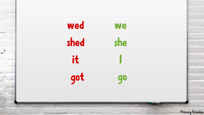 a white board this the words wed shed it got on the left in red and we she I go in green on the right