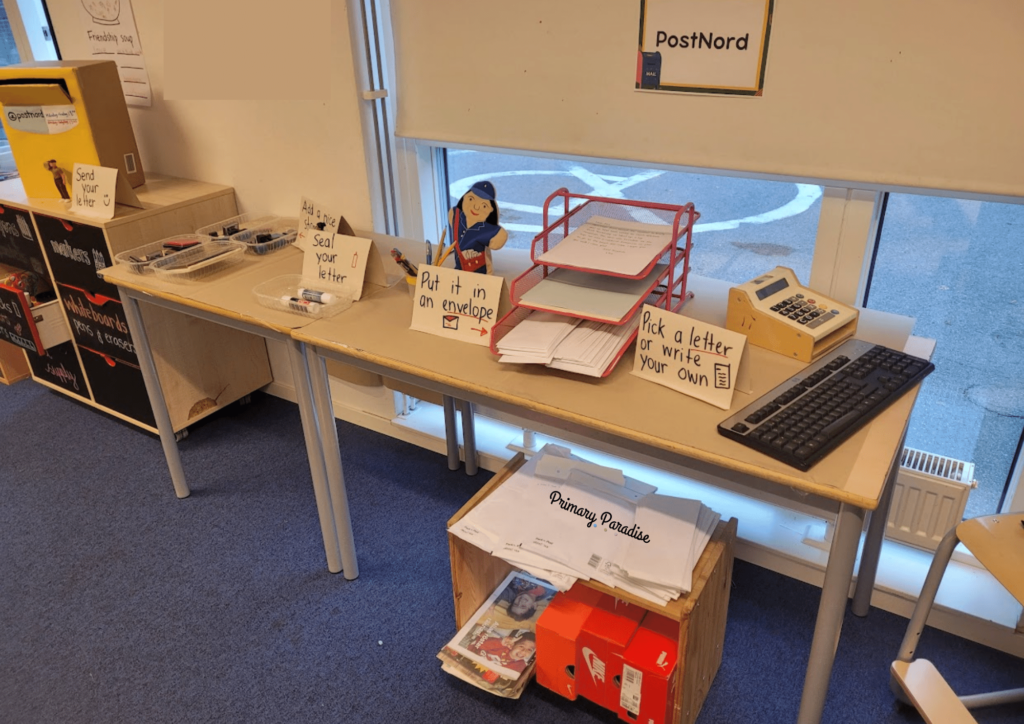 a post office center with paper, letters, envelopes, and other letter mailing supplies