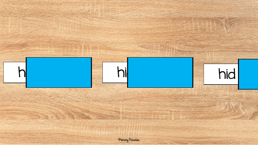 a picture of a a word card that has the word hid on it, first the h is shown, then hi, then hid is shown.