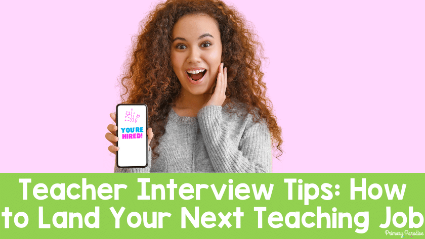 A woman holding out a cell phone with a light pink background. She looks excited and the phone reads "you're hired!" Underneath is a green background with white text that says "Teacher Interview Tips: How to Land Your Next Teaching Job"