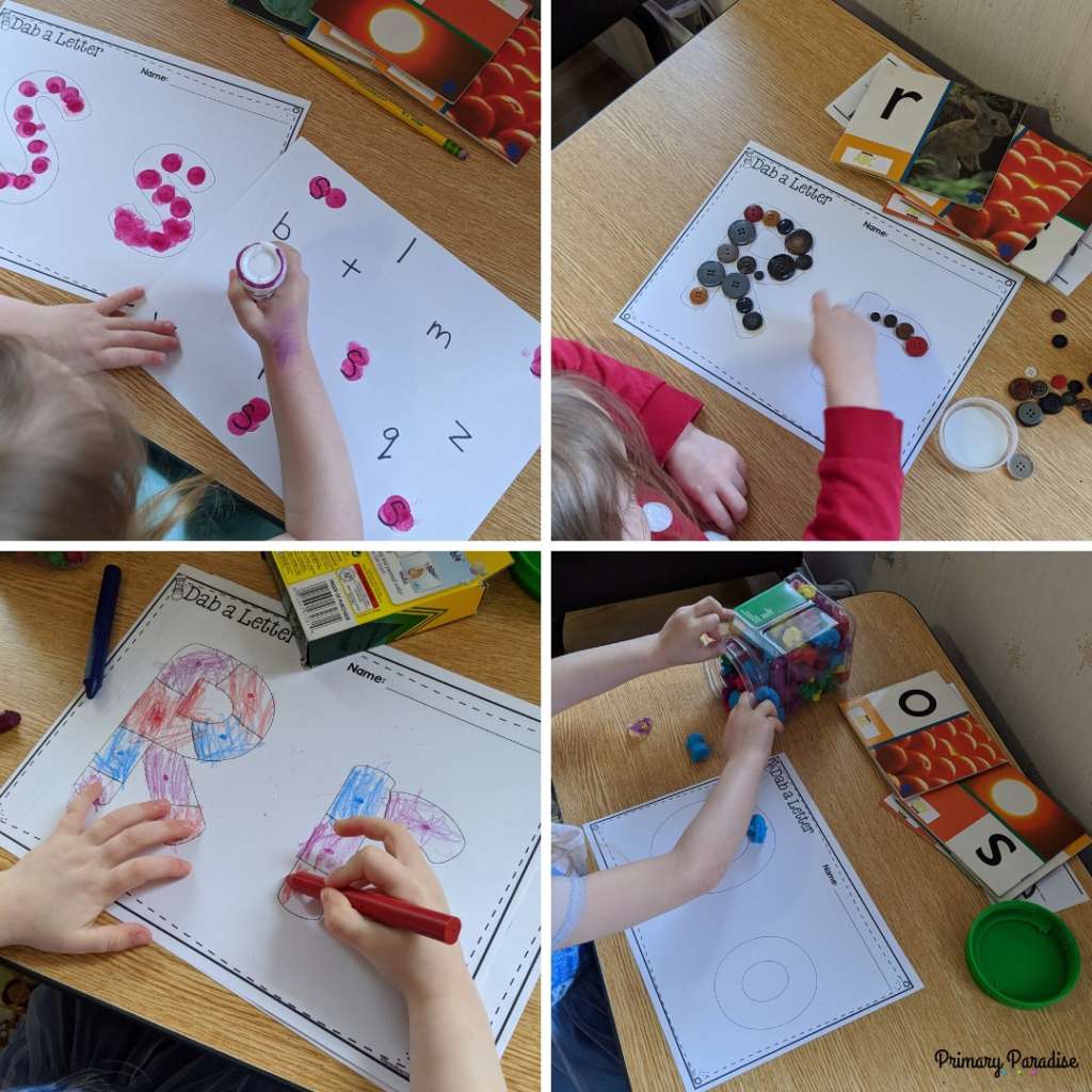 small child using various materials to make letters: bingo dabbers, buttons, crayons, and small animal counters