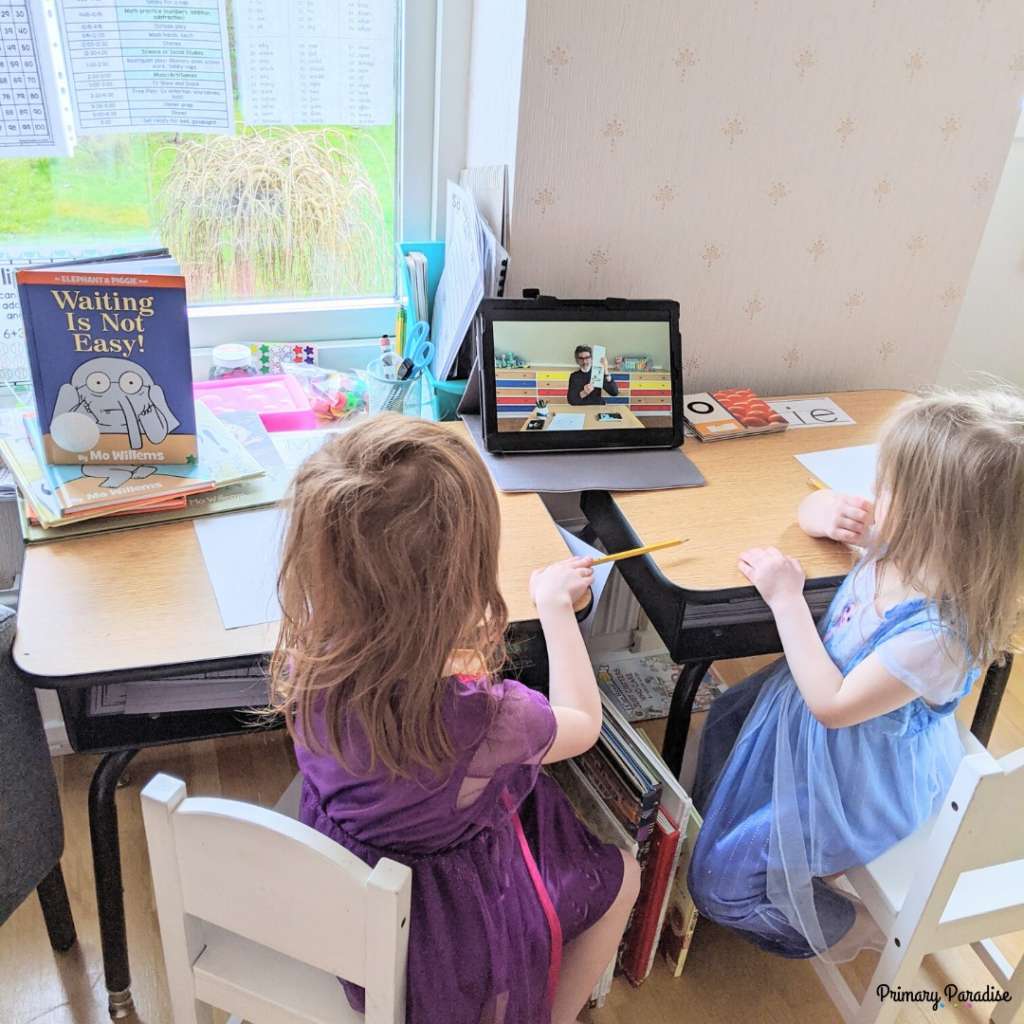 two little girls watching mo willems doodle chats